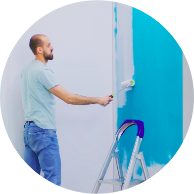Professional Interior Painting – Malik Renovation Interior painter applying fresh coat of paint on wall