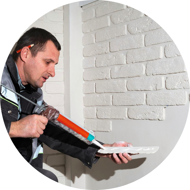 Expert Drywall Repair – Malik Renovation Handyman repairing damaged drywall at home