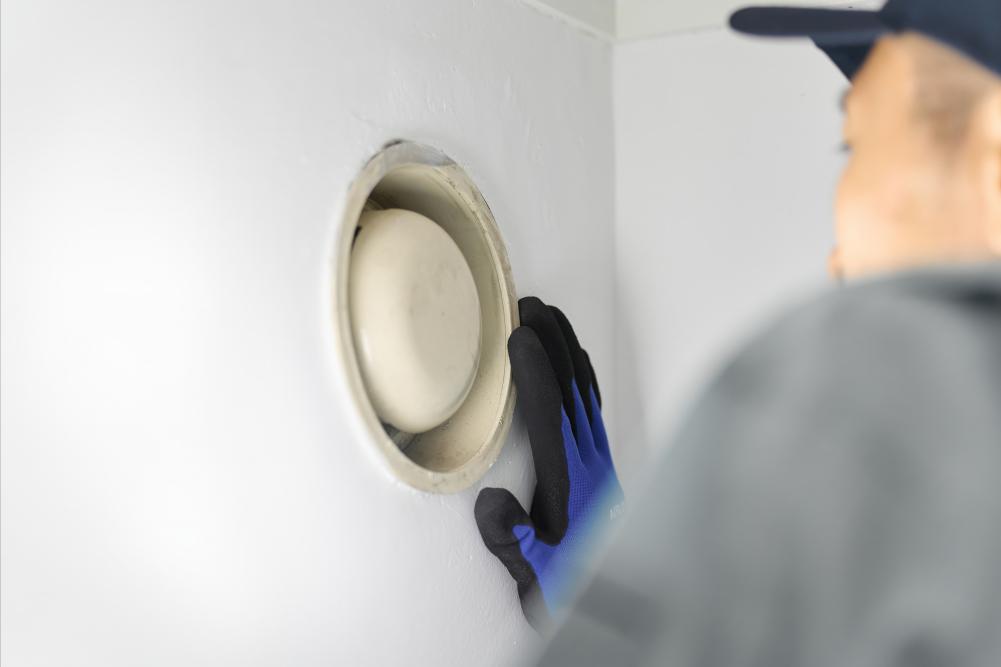 Sanding patched drywall to create smooth finish